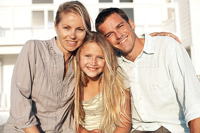 Buy stock photo Portrait, travel and family at house with smile, adventure and bonding at holiday retreat. Happy, people and daughter at accommodation with embrace, parental support and getaway vacation at resort