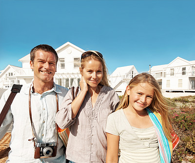 Buy stock photo Portrait, parents and kid for vacation at coast for summer holiday, getaway and relationship. Travel, happy people and child outdoor for weekend break, support or ready for family outing with space