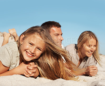 Buy stock photo Smile, relax and child with parents at beach for love, adventure and bonding together on holiday. Portrait, people or rest at seaside with daughter, connection and sightseeing view on summer vacation