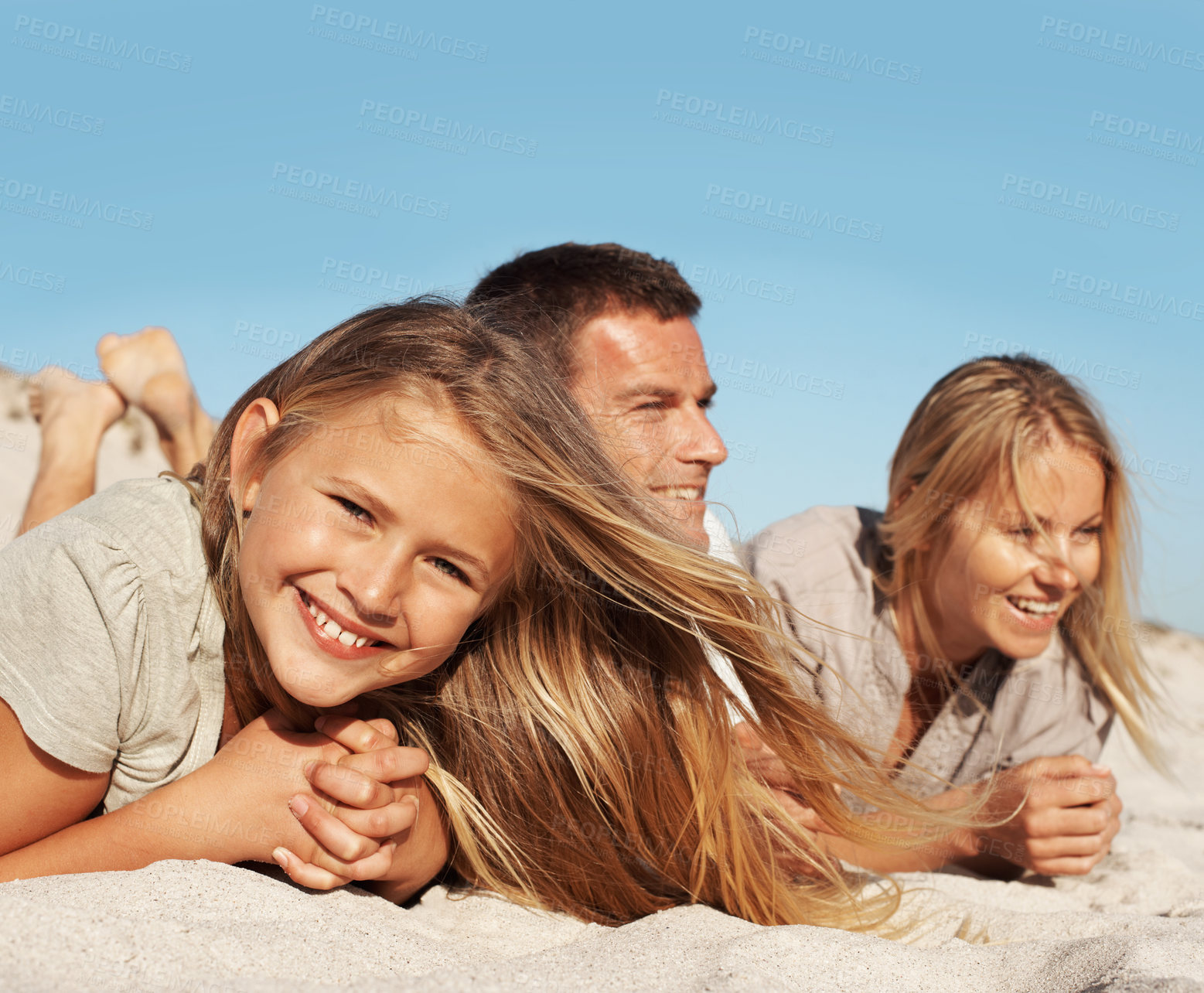 Buy stock photo Smile, relax and child with parents at beach for love, adventure and bonding together on holiday. Portrait, people or rest at seaside with daughter, connection and sightseeing view on summer vacation