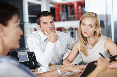 Buy stock photo Listen, woman or couple in consultation with documents for budget planning, loan options or advice. Forms, people or financial advisor in office meeting for debt management, goal setting and guidance
