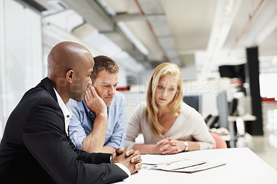 Buy stock photo Explain, documents and financial advisor with couple in meeting, talking and plan for mortgage. People, listen and asset management with paperwork, chat or budget strategy for homeownership at office