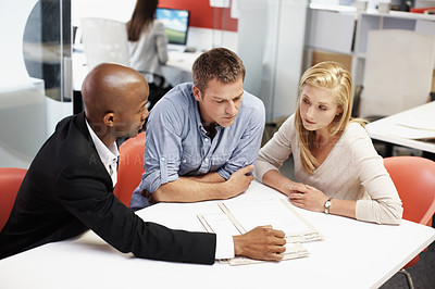Buy stock photo Reading, documents and financial advisor with couple in office, meeting and plan for house purchase. People, listening and asset management with paperwork, chat and budget strategy for homeownership
