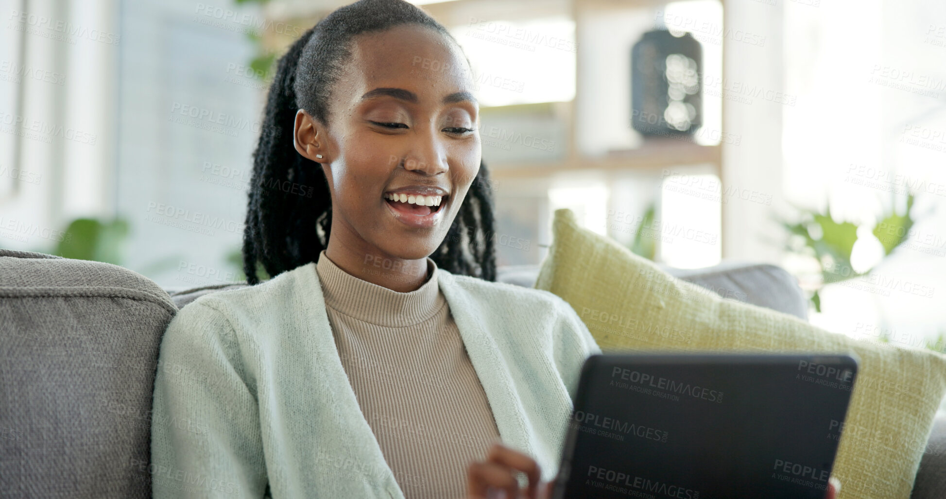 Buy stock photo Woman, online and laughing with tablet in lounge, entertainment and watching movie with subscription. Happy, black person and streaming funny video with tech, relax and chilling on couch in house
