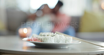 Buy stock photo Food, chopsticks and sushi on plate for lunch date, Japanese cuisine or bokeh in living room. Meal, people or pickled ginger with rice for appetizer, seafood catering or nutrition with candle in home
