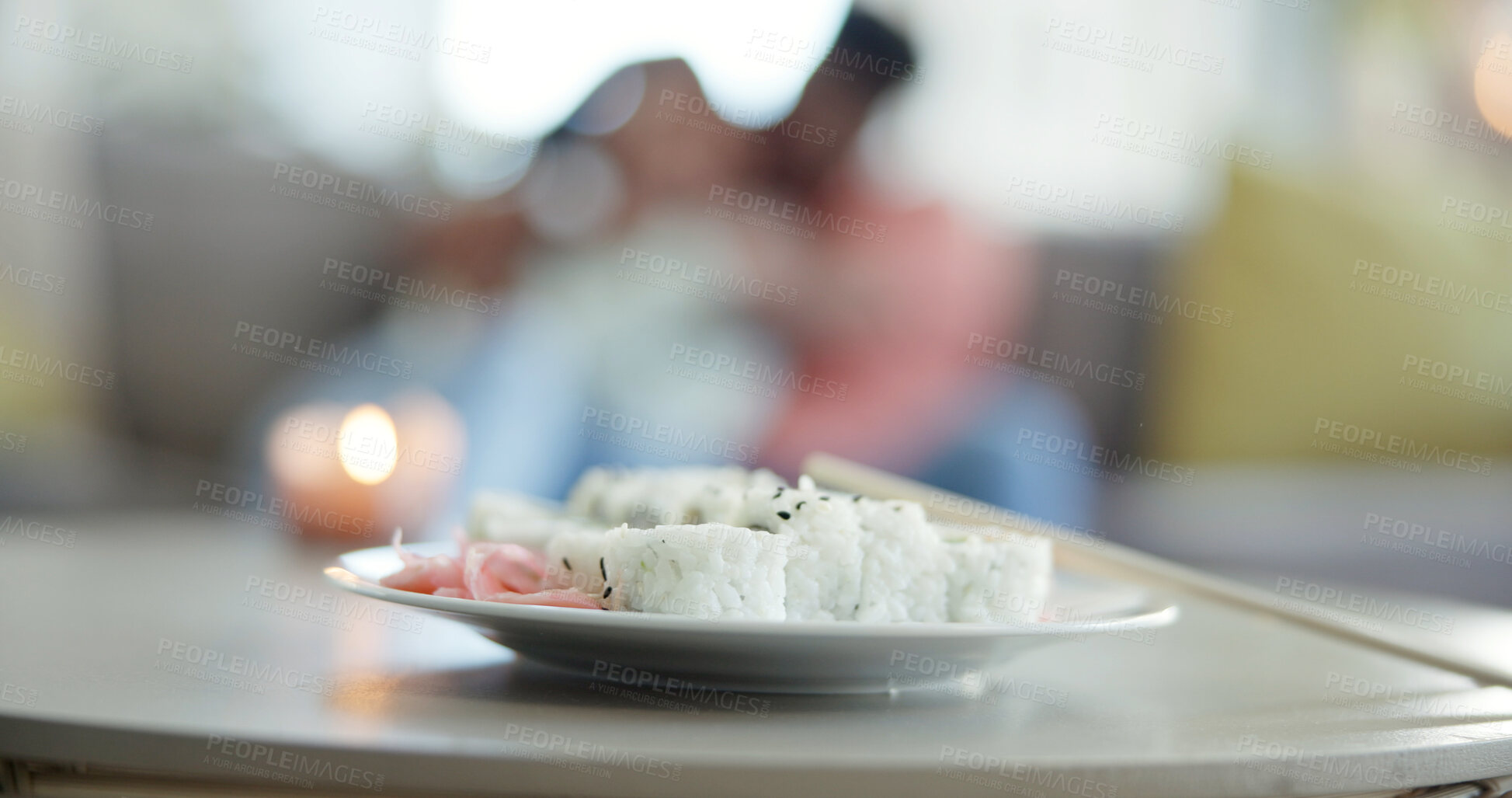 Buy stock photo Food, chopsticks and sushi on plate for lunch date, Japanese cuisine or bokeh in living room. Meal, people or pickled ginger with rice for appetizer, seafood catering or nutrition with candle in home