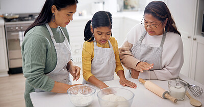 Buy stock photo Baking, grandmother, mother with child in kitchen, teaching culinary skills and meal prep assistance. Bonding, women or girl with dough for cooking support, generations or learn family recipe in home