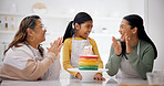 Child, family and clapping with birthday cake in home after baking, laugh and generations sing. Mother, grandmother and girl with applause at party, rainbow dessert or excited to celebrate in kitchen