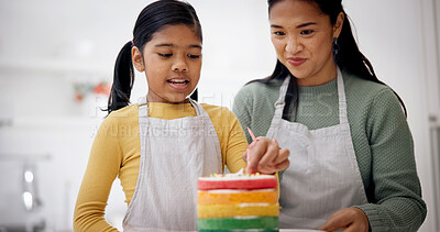 Buy stock photo Child, mother and candles on birthday cake for baking at home, celebration or special day. Parent, decoration or girl with rainbow dessert at party for help, preparation or learning in family kitchen