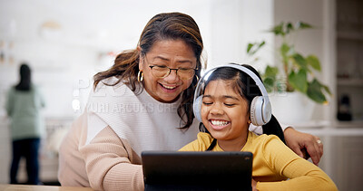 Buy stock photo Tablet, headphones and grandmother with student for elearning, online lesson or studying in home. Digital technology, help and senior woman with girl child for virtual class with development in house