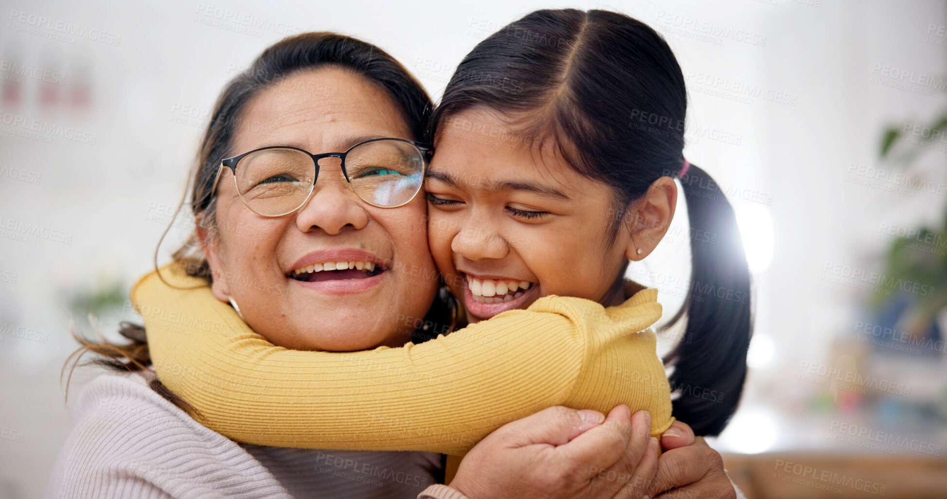 Buy stock photo Love, grandmother and child with hug in home for support, affection and security for weekend bonding. Portrait, senior woman and girl with embrace for connection, relationship development and smile