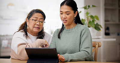Buy stock photo Reading, woman and senior mother with tablet in home, homepage setup or system teaching for bonding. Tech education, learn or Asian people with advice for digital literacy, app navigation or guidance