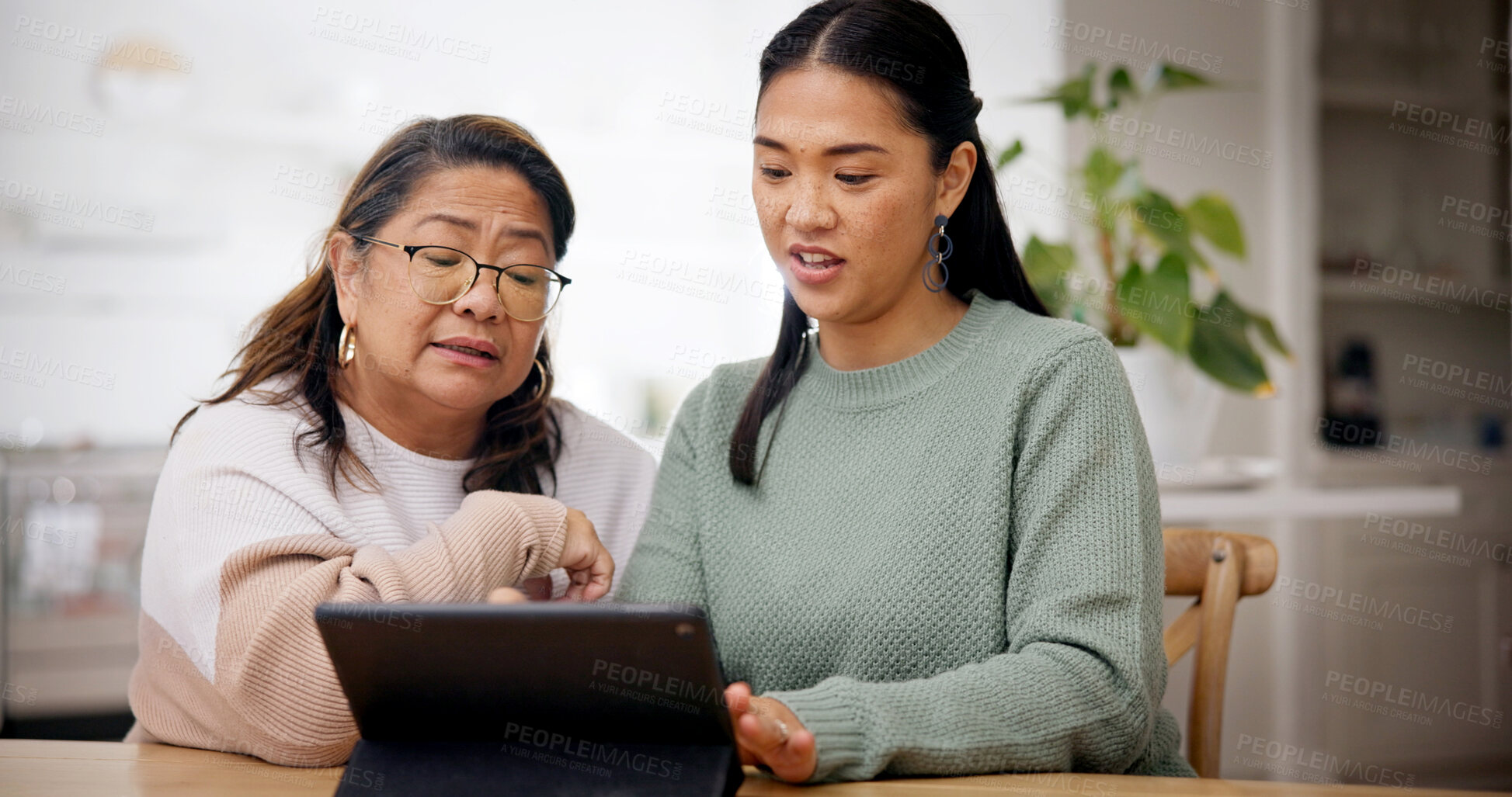 Buy stock photo Reading, woman and senior mother with tablet in home, homepage setup or system teaching for bonding. Tech education, learn or Asian people with advice for digital literacy, app navigation or guidance