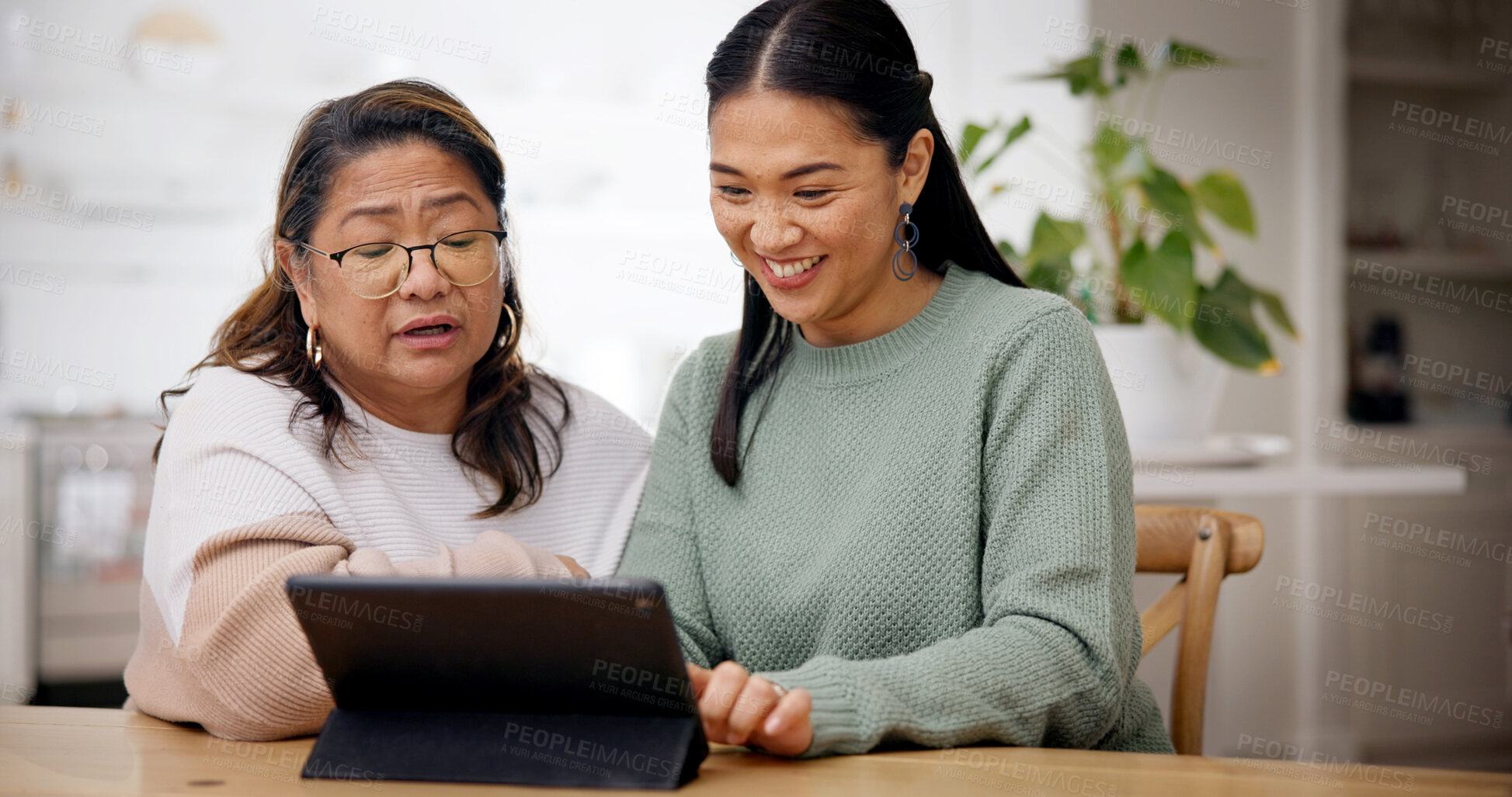 Buy stock photo Teaching, woman and senior mother with tablet in home, homepage setup or system review for bonding. Tech education, learning or Asian people with advice for digital literacy, app navigation or smile