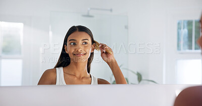 Buy stock photo Woman, happy and mirror in house with hairbrush for morning routine, grooming and hair care in bathroom. Bamboo brush, smile and reflection with person in home for beauty, selfcare and getting ready