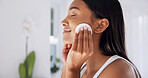 Smile, pad and woman in bathroom for skincare, hygiene and cleaning face with makeup remover. Happy, female person or cosmetics in home with cotton, facial cleanser and treatment for dermatology glow