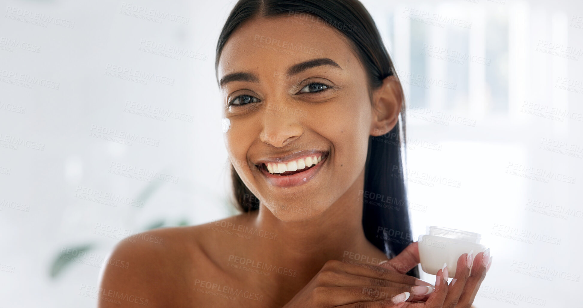 Buy stock photo Portrait, skincare and woman in cream jar for hydration, skin benefits and wellness in bathroom. Smile, person and cosmetics product, lotion and hyaluronic acid moisturizer for natural beauty at home