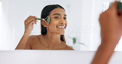Buy stock photo Mirror, skincare or woman with jade roller for beauty, lymphatic drainage or smile at bathroom. Home, reflection or person with tool for facial massage, circulation or dermatology benefits in morning