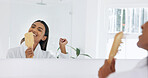 Woman, happy and singing in mirror with hairbrush for morning routine, fun and hair care in bathroom. Bamboo brush, smile and reflection with person in home for beauty, karaoke and getting ready