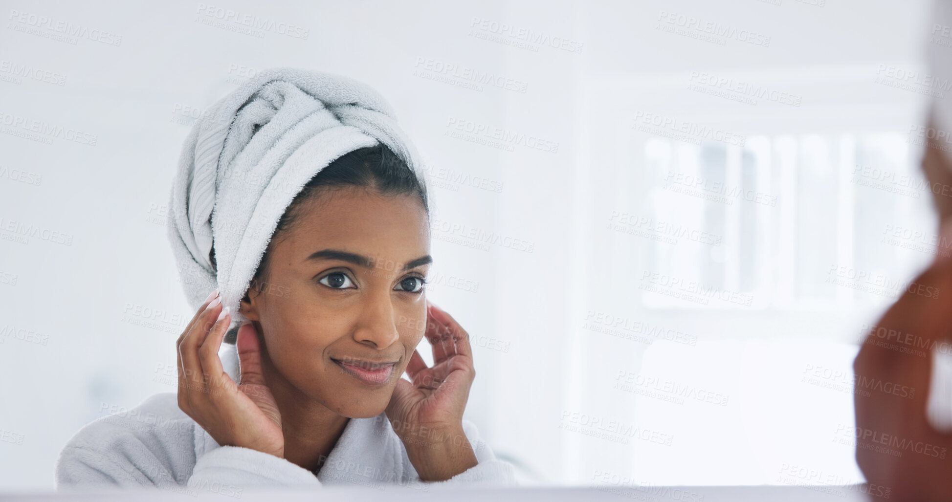 Buy stock photo Woman, towel and hair care in bathroom with mirror, morning skincare routine or grooming for wellness. Happy Indian person, getting ready and reflection in home with dermatology, beauty or cosmetics.
