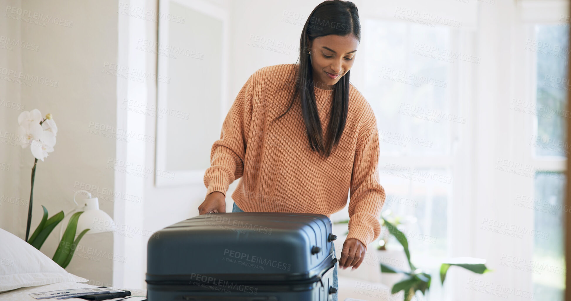 Buy stock photo Close, suitcase or woman with smile in bedroom, travel preparation or international trip for holiday. Home, getting ready and person with organization of vacation wardrobe, weekend break and luggage