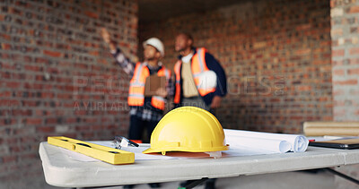Buy stock photo Architect, helmet and blueprint on desk in construction site, men and ideas for property development. Building, civil engineering and people with plans for architecture, documents and collaboration