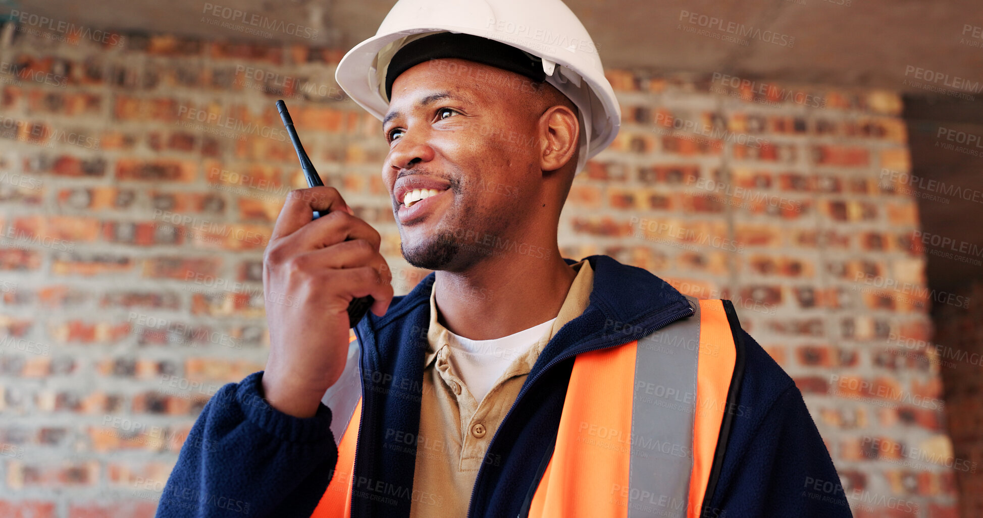 Buy stock photo Construction site, radio and black man with smile, engineering and update for quality control. Tech, risk assessment and person with communication, compliance and property renovation with development