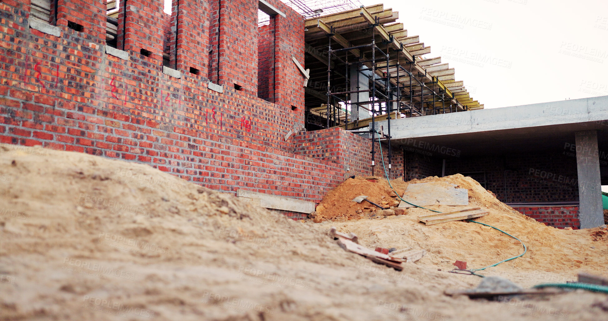Buy stock photo Sand, house and real estate project for construction, development and home renovation. Property, brick wall and architecture with structure, building material and suburban improvement or engineering