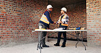 Civil engineer, handshake and happy men with clipboard in building, discussion or safety inspection. Architect, shaking hands or people with blueprint for property renovation, smile and collaboration