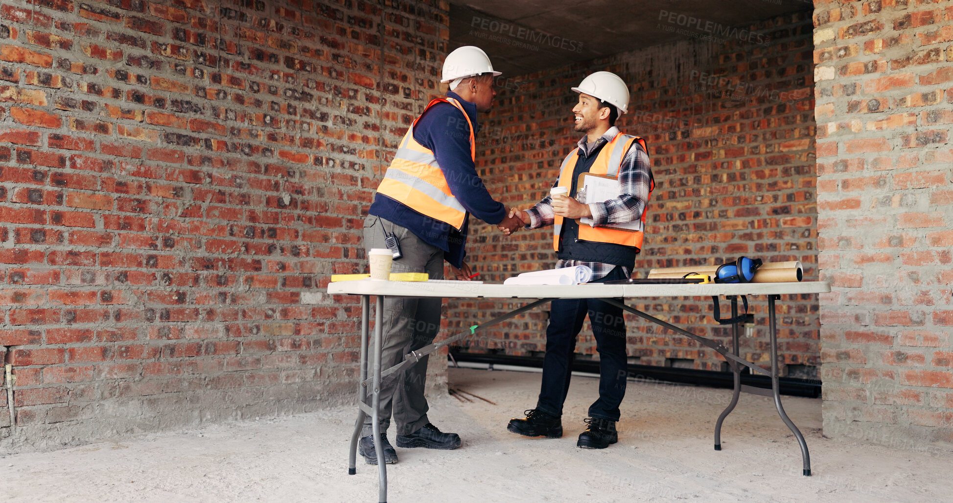 Buy stock photo Civil engineer, handshake and happy men with clipboard in building, discussion or safety inspection. Architect, shaking hands or people with blueprint for property renovation, smile and collaboration