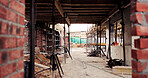 Scaffolding, property and real estate for construction, development project and home renovation. House, brick wall and architecture with structure, building and suburban improvement or engineering