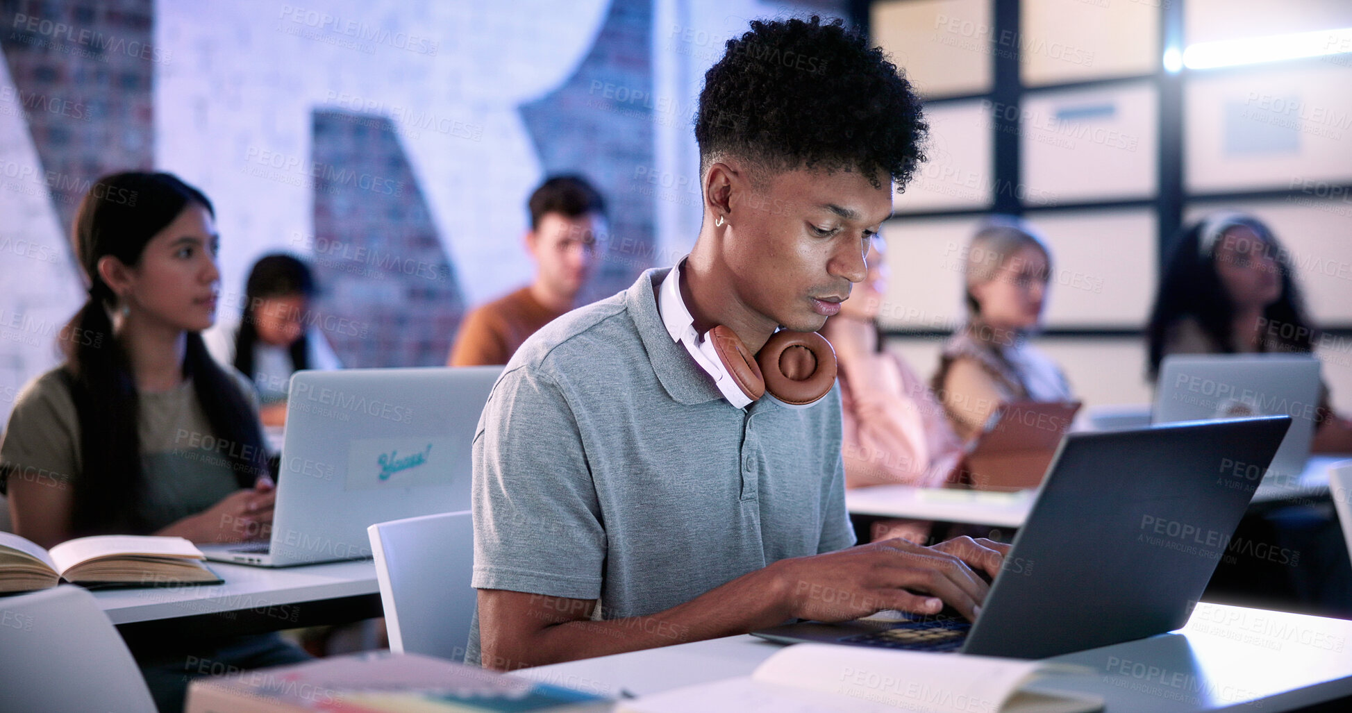 Buy stock photo Typing, students and man with laptop in lecture, college course notes and learning for development. Education, academic research and scholar with pc for class assignment, studying and planning essay
