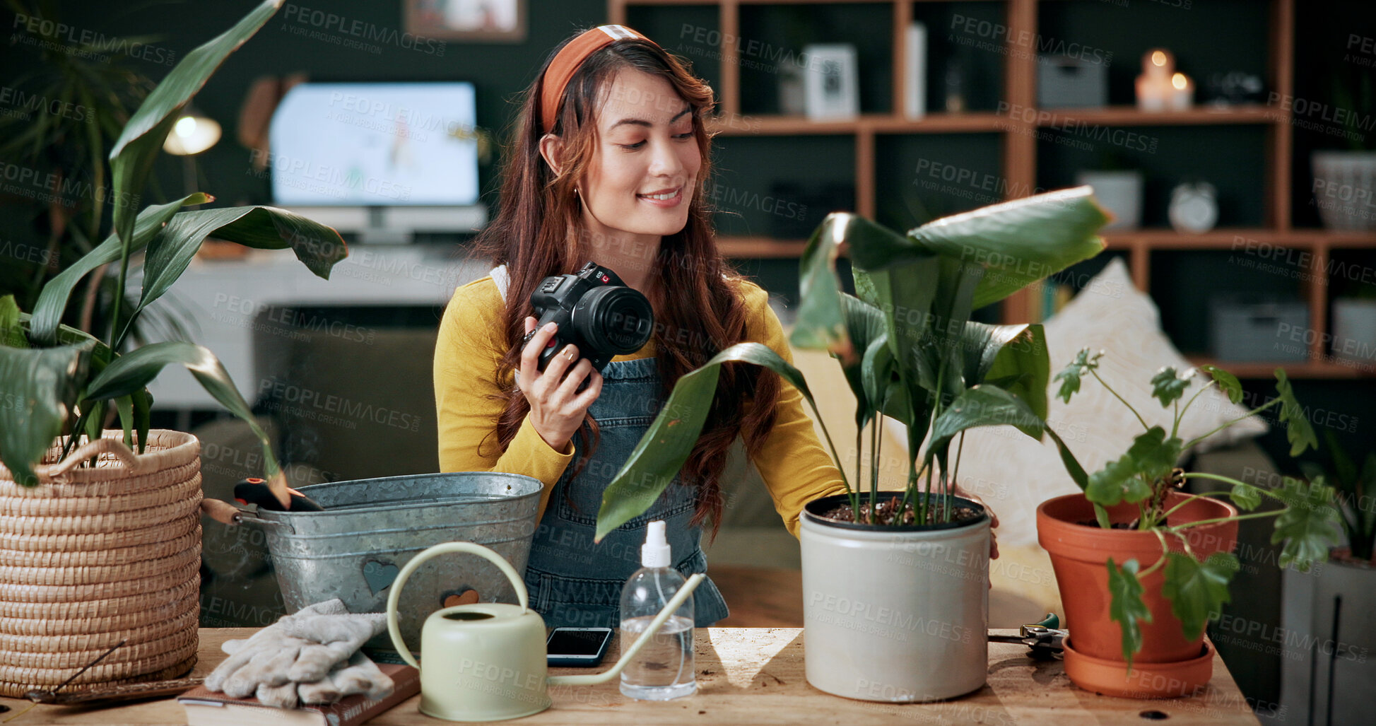 Buy stock photo Remote work, camera or woman in home with plant, greenery review or picture for gardening blog. Happy, check or content writer with houseplant, horticulture or growth photography in botanical article
