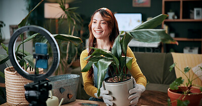 Buy stock photo Gardening, woman and plants in home with ring light, phone recording video and social media influencer. Happy person, talk and content creation with greenery, horticulture advice and live streaming.