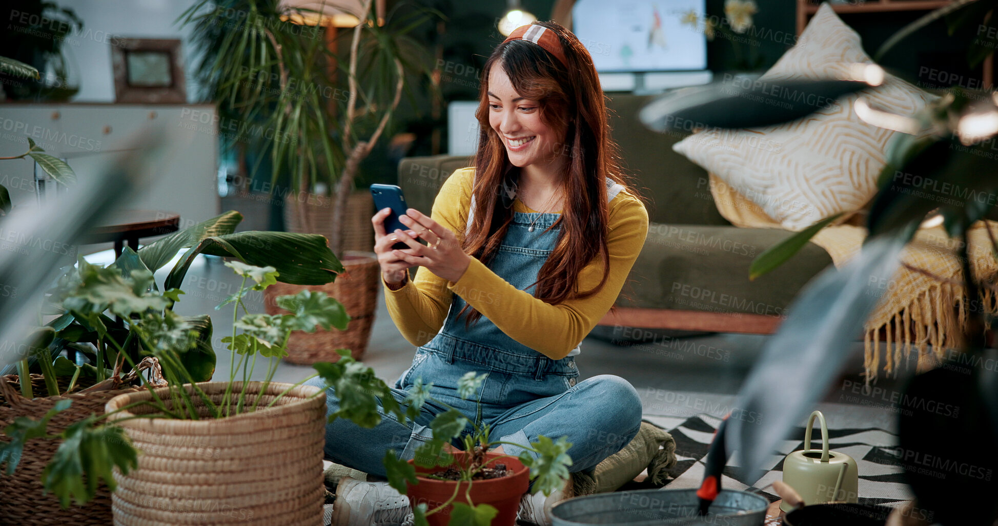 Buy stock photo Picture, plants or woman in home with phone, greenery review or gardening blog in remote work. Happy, freelancer or journalist with tech, horticulture or growth photography for botanical article.