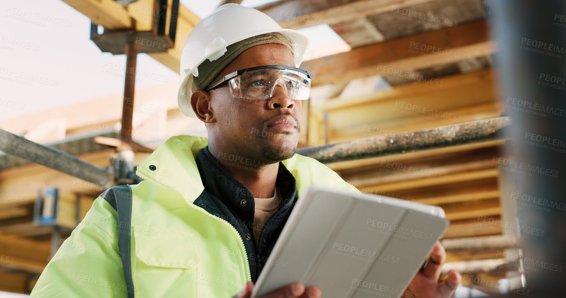 Buy stock photo Construction, man and thinking with tablet on site for building progress, property vision or safety. Supervisor, black person and tech outdoor for renovation inspection, reflection or risk assessment