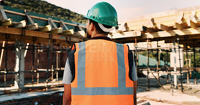 Buy stock photo Construction site, thinking and back of man for inspection, planning and building project. Architecture, civil engineer and person with idea for property development, renovation and infrastructure