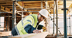 Planning, man and construction worker by infrastructure on site for building, repairs or maintenance. Wood, professional and male civil engineer with timber measurement for home renovation project.