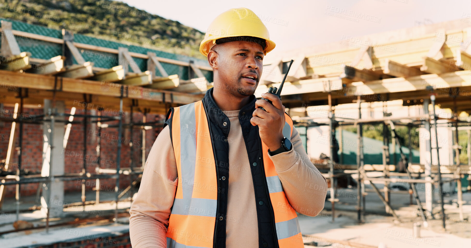 Buy stock photo Talking, outdoor and black man with radio on construction site for contact, update and planning. Architecture, engineering and person with communication for building plan, feedback and infrastructure