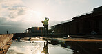 Fist pump, celebration and man at construction site for architecture, back and successful inspection. Outdoor, civil engineer and person with achievement on roof, space and property development