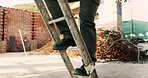 Construction site, legs and ladder with person for building inspection, renovation project or protocol. Worksite, safety manager and risk assessment for demolition, quality control or development