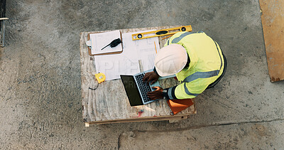 Buy stock photo Documents, laptop and above of man on construction site for planning, building permit and compliance. Architecture, engineer and person on computer for renovation, online blueprint and infrastructure