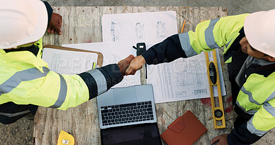 Buy stock photo Construction, team and architect with handshake outdoor for site handover, legal closure or agreement. Architecture, above and men shaking hands for duty transfer, professional trust or cooperation