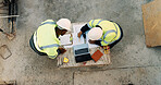 Meeting, laptop and men with blueprint on construction site for planning, building project and teamwork. Architecture, discussion and above of people for renovation, layout or infrastructure design
