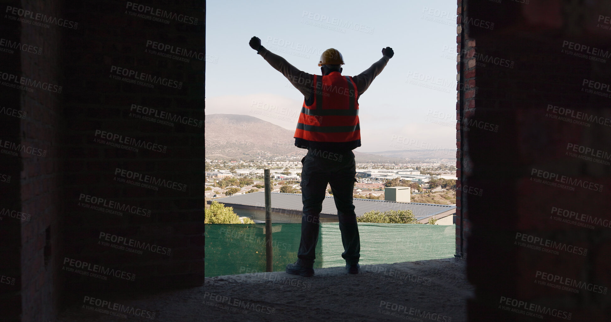 Buy stock photo Back, construction and worker celebration on site for inspection pass, building safety or success. Project manager, proud man and fist pump for development progress, structural approval and milestone