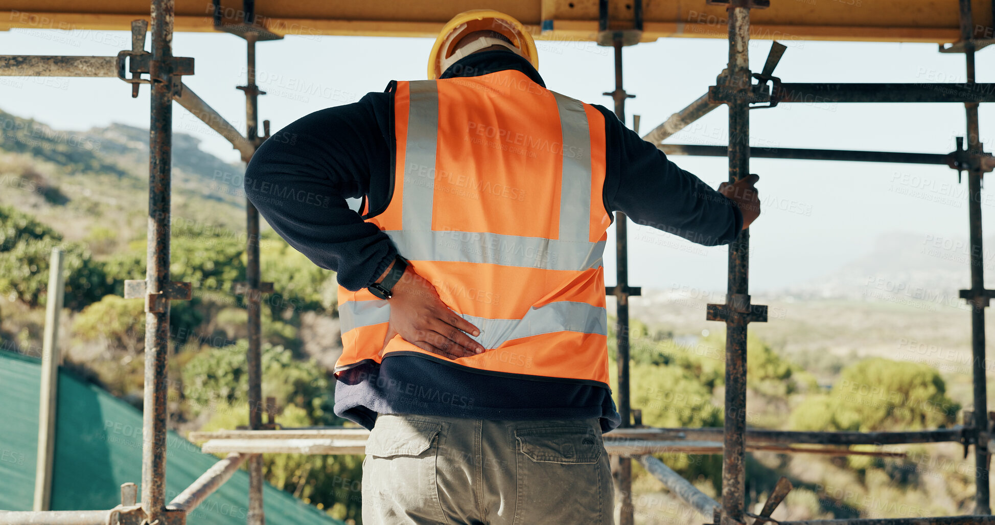 Buy stock photo Construction, injury and man with back pain for accident, stress and overworked at building site. Architecture, engineering and person with pressure for fibromyalgia, muscle sprain and hurt outdoor