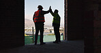 Happy, high five and men in building with construction progress, support and celebrate for project. Architecture, collaboration and people with gesture for success with infrastructure or renovation