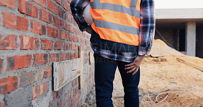 Buy stock photo Construction, injury and man with leg pain for accident, stress and overworked at building site. Architecture, engineering and back of person with muscle fatigue for fibromyalgia, sprain and hurt