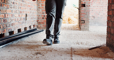 Buy stock photo Walking, building and feet of person on construction site for planning, infrastructure and inspection. Architecture, civil engineer and legs of worker for property, renovation and remodeling project