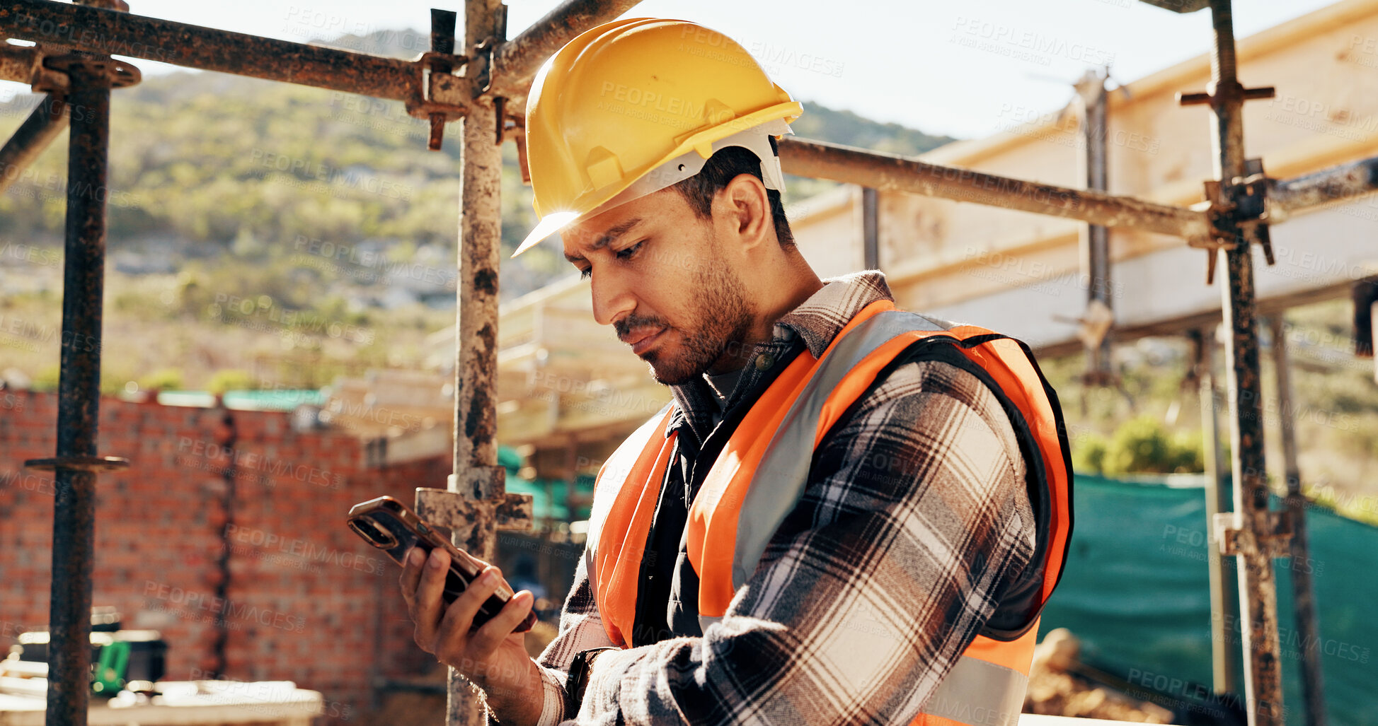 Buy stock photo Phone, man and construction worker on site with texting for feedback on building infrastructure. Cellphone, communication and civil engineer with email for review on home renovation or development.